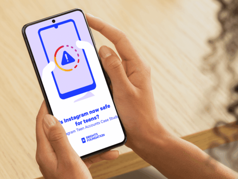 Person holding a smartphone displaying a screen with a warning icon inside an Instagram-style loading ring. The text on the screen reads: ‘Is Instagram now safe for teens’ Instagram Teen Accounts Case Study' with the 5Rights Foundation logo beneath it.